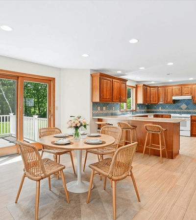 Bright and spacious kitchen featuring modern appliances, a large island, and abundant natural light.
