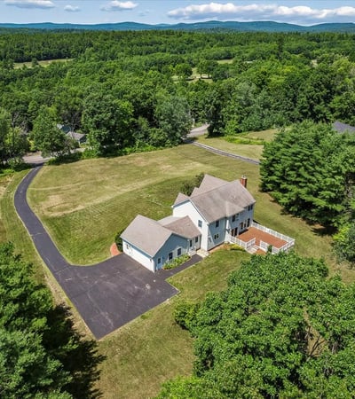 Spacious home on a large lot, surrounded by lush greenery and scenic mountain views. Perfect for tranquility!