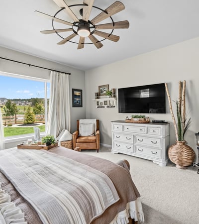 Primary Suite with attached 5 piece bath and walk in closet.