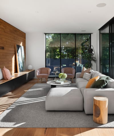 Modern living room featuring sleek design, ample natural light, and seamless indoor-outdoor flow perfect for entertaining.