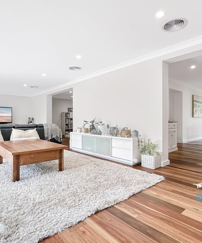 Bright and airy living space with natural light, featuring hardwood floors and an inviting, open layout.