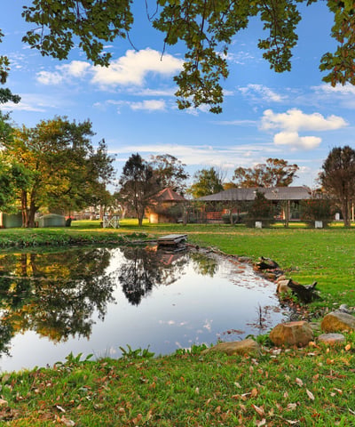 Discover a picturesque waterfront property surrounded by lush greenery and ample outdoor space for relaxation.