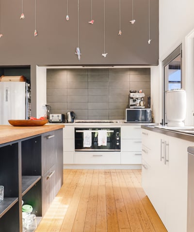 Contemporary kitchen featuring modern appliances, spacious countertops, and unique decorative accents for a vibrant cooking space.