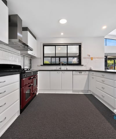 Modern kitchen featuring ample storage, high-end appliances, and a spacious layout perfect for culinary enthusiasts.