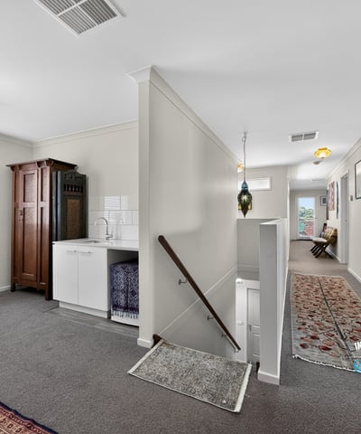 Spacious, well-lit entryway featuring a unique blend of modern convenience and classic design elements.