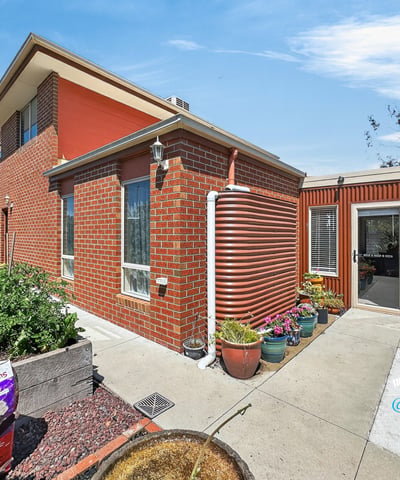 This distinctive home features a unique design, spacious garden, and ample natural light throughout.