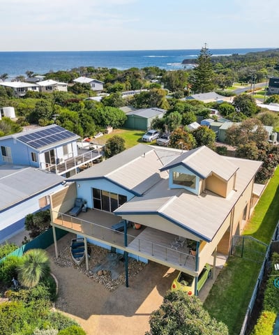 Spacious coastal home offers stunning ocean views, convenient access to local amenities, and ample outdoor space.