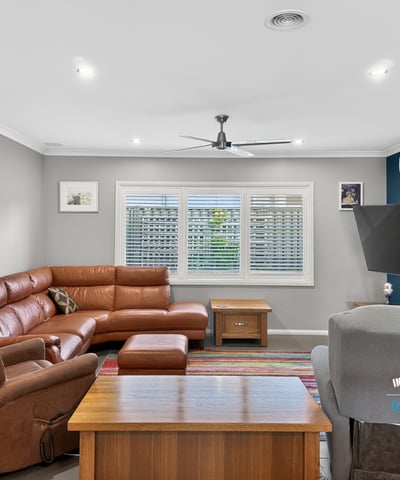 Spacious living area featuring a modern layout, comfortable seating, and abundant natural light throughout.