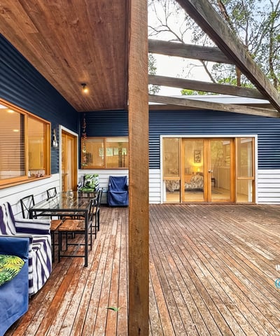 Spacious outdoor deck offers seamless indoor-outdoor living, perfect for entertaining amid a tranquil natural setting.