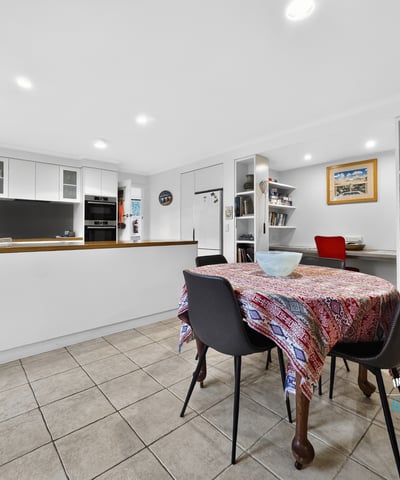 Bright and functional kitchen featuring modern appliances, ample storage, and a cozy dining area.
