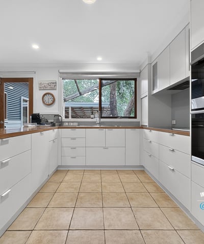 Modern kitchen featuring ample storage, contemporary appliances, and a spacious layout ideal for cooking and entertaining.