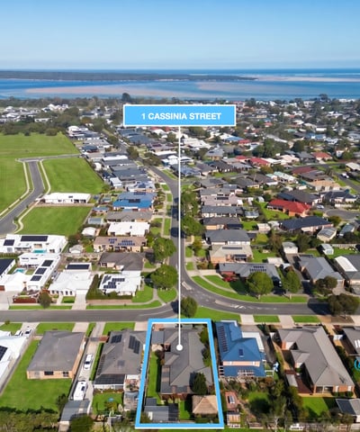 Expansive coastal lot in a developing neighborhood, offering stunning water views and convenient access to local amenities.