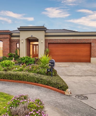 Discover this inviting home featuring lush landscaping, a spacious driveway, and ample natural light throughout.