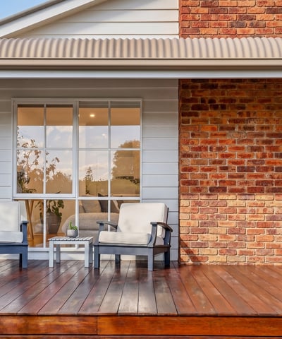 Relax on the spacious deck, featuring inviting seating and a blend of modern and classic design.