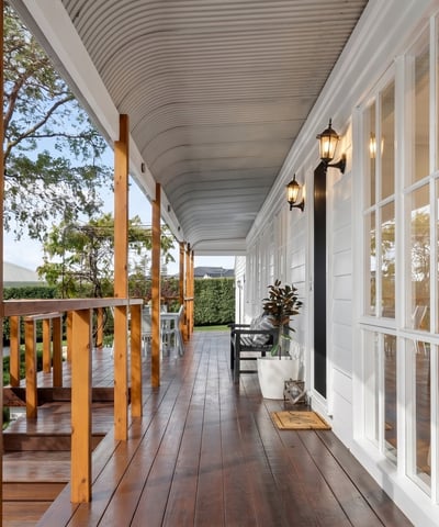 Discover this inviting porch offering a perfect blend of outdoor relaxation and easy access to the home.