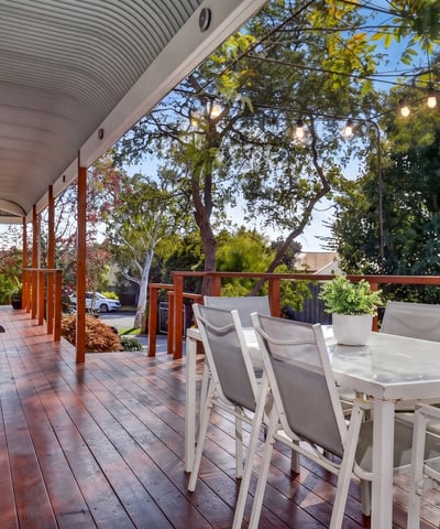 Relax on this expansive deck with captivating views and ample space for entertaining family and friends.