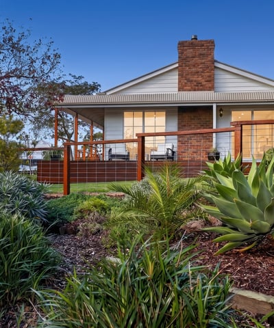 Discover a stunning home with expansive outdoor spaces and picturesque landscaping, perfect for relaxing or entertaining.