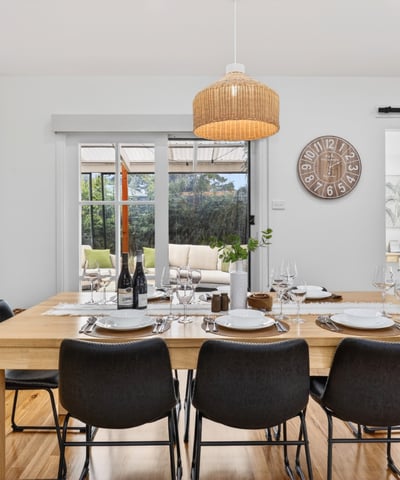 Bright dining area featuring natural wood accents, perfect for gatherings and everyday meals with family.