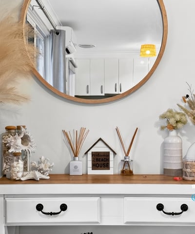 Discover a welcoming entryway featuring unique decor, creating an inviting atmosphere for every guest.