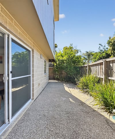 Spacious outdoor area offers a low-maintenance retreat, perfect for lounging or entertaining guests.