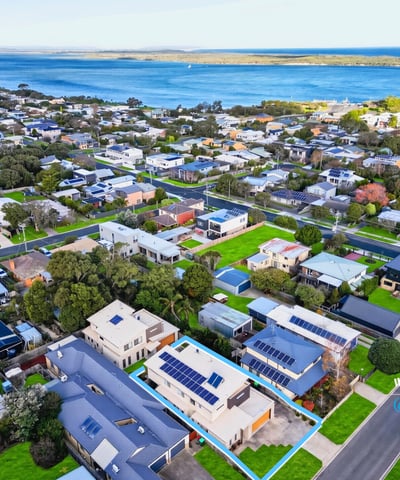 Experience coastal living with this modern home in a vibrant community, offering breathtaking water views.