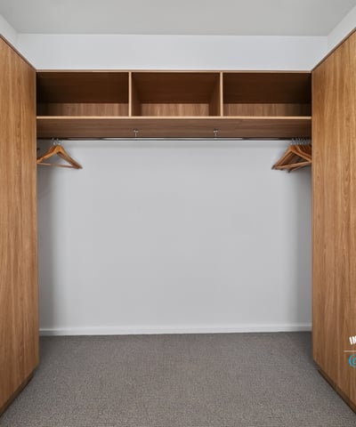 Spacious closet featuring ample storage with built-in shelving and hanging options for efficient organization.