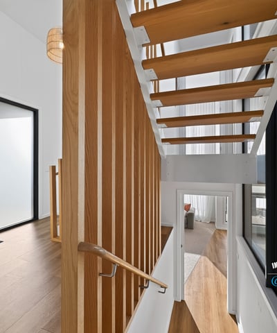 Contemporary open staircase showcases modern design, enhancing the home's inviting and spacious atmosphere.