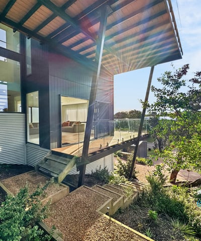 Modern architectural design features expansive outdoor views and vibrant landscaping for a unique living experience.