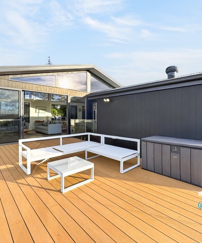 Spacious outdoor deck with modern seating, perfect for entertaining and enjoying views in a contemporary setting.