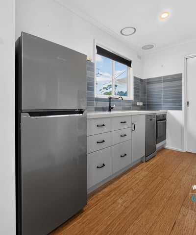 Modern kitchen featuring sleek appliances, ample storage, and a bright, inviting atmosphere perfect for cooking.