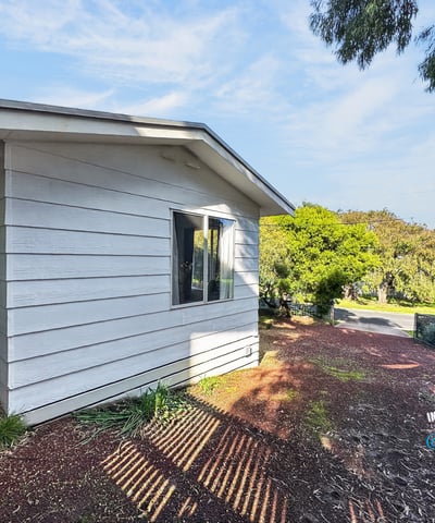 This contemporary home features a distinct design and abundant natural light in a peaceful neighborhood.