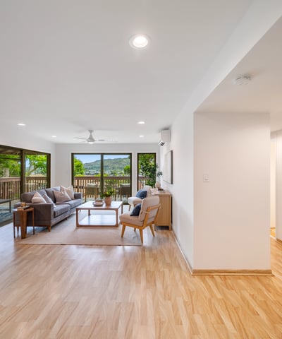 Spacious living area with natural light, panoramic views, and seamless indoor-outdoor flow ideal for entertaining.