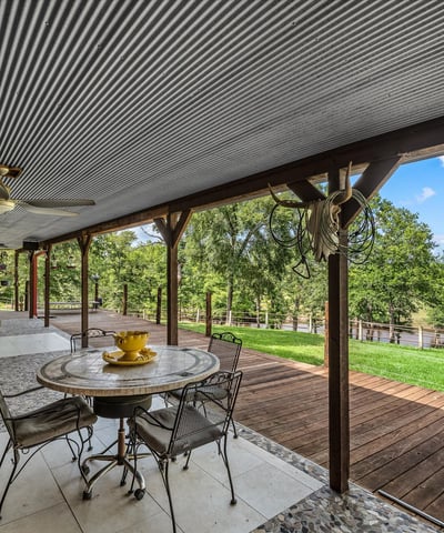 Spacious outdoor deck with panoramic views, perfect for entertaining or enjoying tranquil moments in nature.