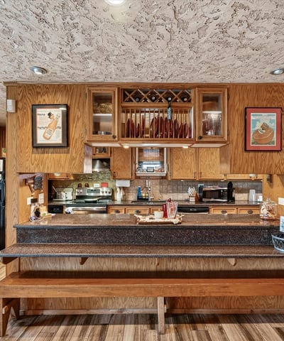 This inviting kitchen features ample counter space and a unique design, perfect for gatherings and culinary creativity.