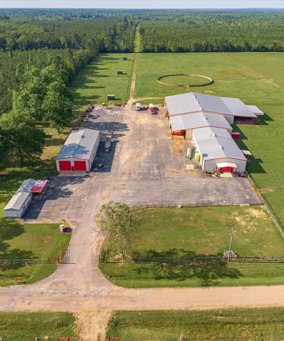 Spacious 20-acre property featuring multiple outbuildings, extensive land for farming, and scenic views.