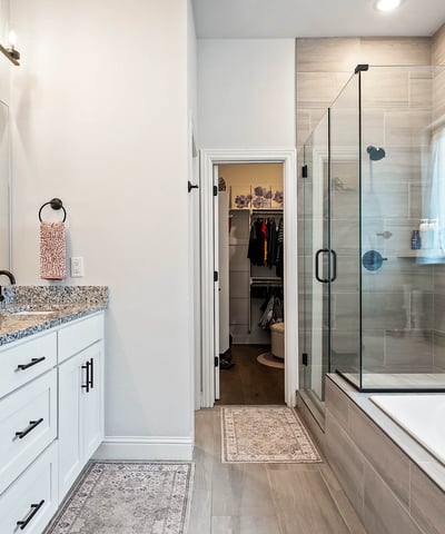 Primary bath soaking tub, walk in shower with glass surround. Dual sink vanity & walk in closet