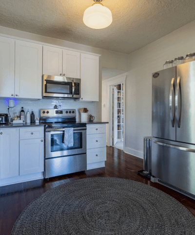 This well-appointed kitchen features modern appliances and ample counter space, perfect for culinary enthusiasts.