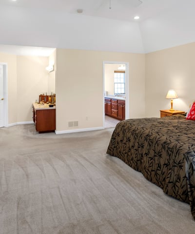 The Primary Bedroom Suite features an expansive walk-in closet, dressing area, and en suite bath.