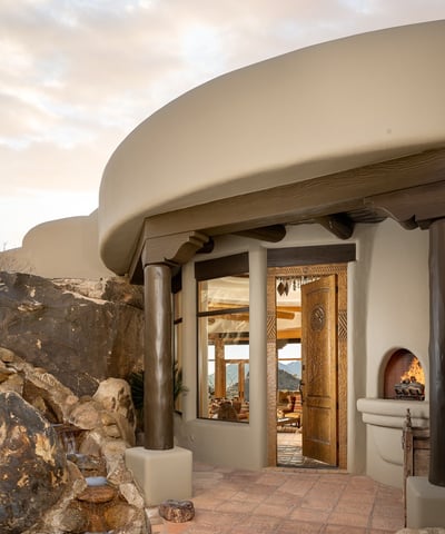 This glowing nighttime setting captures the magic of Arizona evenings. Soft lighting, peaceful views, and luxurious finishes make this poolside space a tranquil haven under the stars.
