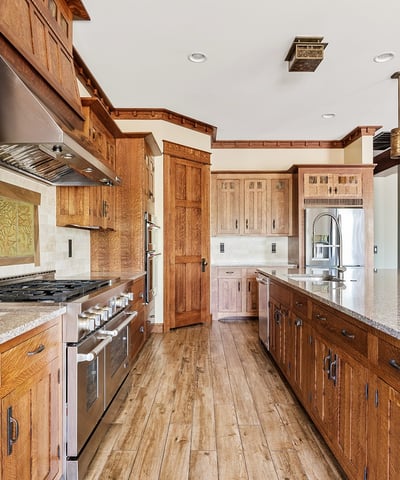 Gourmet kitchen equipped with professional appliances, custom cabinetry, and expansive prep space. Designed for culinary enthusiasts, this Phoenix home offers elevated finishes and everyday practicality.