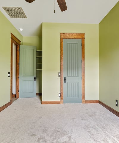 Well-proportioned bedroom with custom trim details, neutral tones, and inviting natural light. Ideal for flexible living arrangements or guest accommodations.