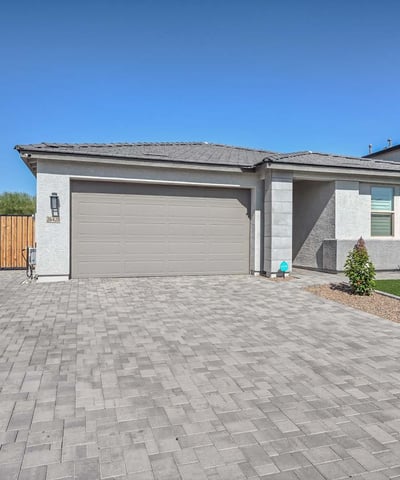 This eye-catching Peoria home showcases a sleek exterior design with a wide paver driveway, manicured synthetic turf, and a welcoming front entry. The spacious two-car garage and side RV gate offer added convenience and storage flexibility. Designed with curb appeal and low-maintenance living in mind, the home blends modern elegance with functional upgrades that enhance everyday living and energy efficiency.