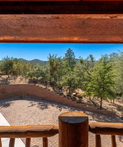 Deck space capturing tranquil pine views and open skies, offering a peaceful outdoor extension of the home.