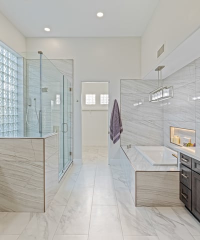 Remodeled primary bath with soaking tub, dual vanities, and spa-inspired shower offers a luxurious retreat.