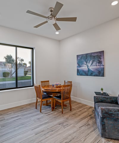 A versatile fourth bedroom with a large window, stylish flooring, and plenty of natural light makes this space ideal for guests or a home office.