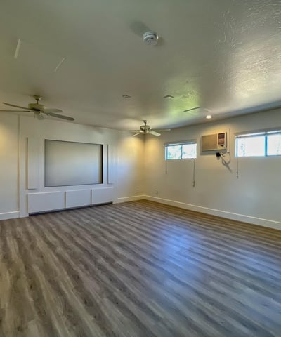 Expansive upstairs room ideal for media, office, or fitness space. Recessed lighting and clean finishes enhance its versatility.