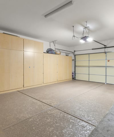 Extended garage with built-in cabinetry and workbench area, perfect for hobbyists, extra storage, or home projects.