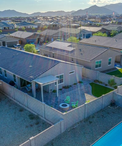 Overhead view showing plenty of room for dining, lounging, and entertaining. The blend of pavers and turf enhances both function and visual appeal.