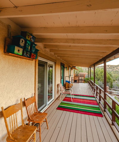 Stretching along the length of the home, this covered porch highlights mountain views, fresh air, and the tranquil desert environment unique to Hackberry.