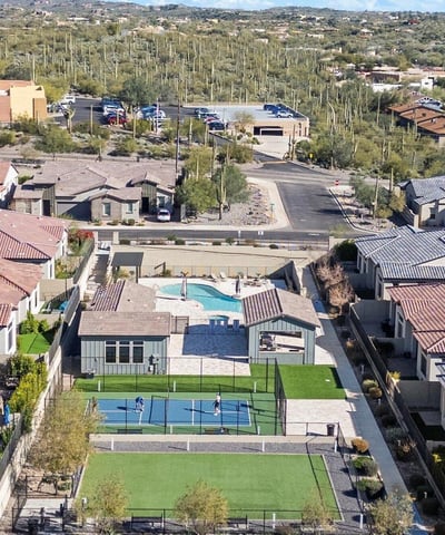 Scenic overview of shared community amenities surrounded by desert landscaping and mountain views, enhancing the neighborhood lifestyle.